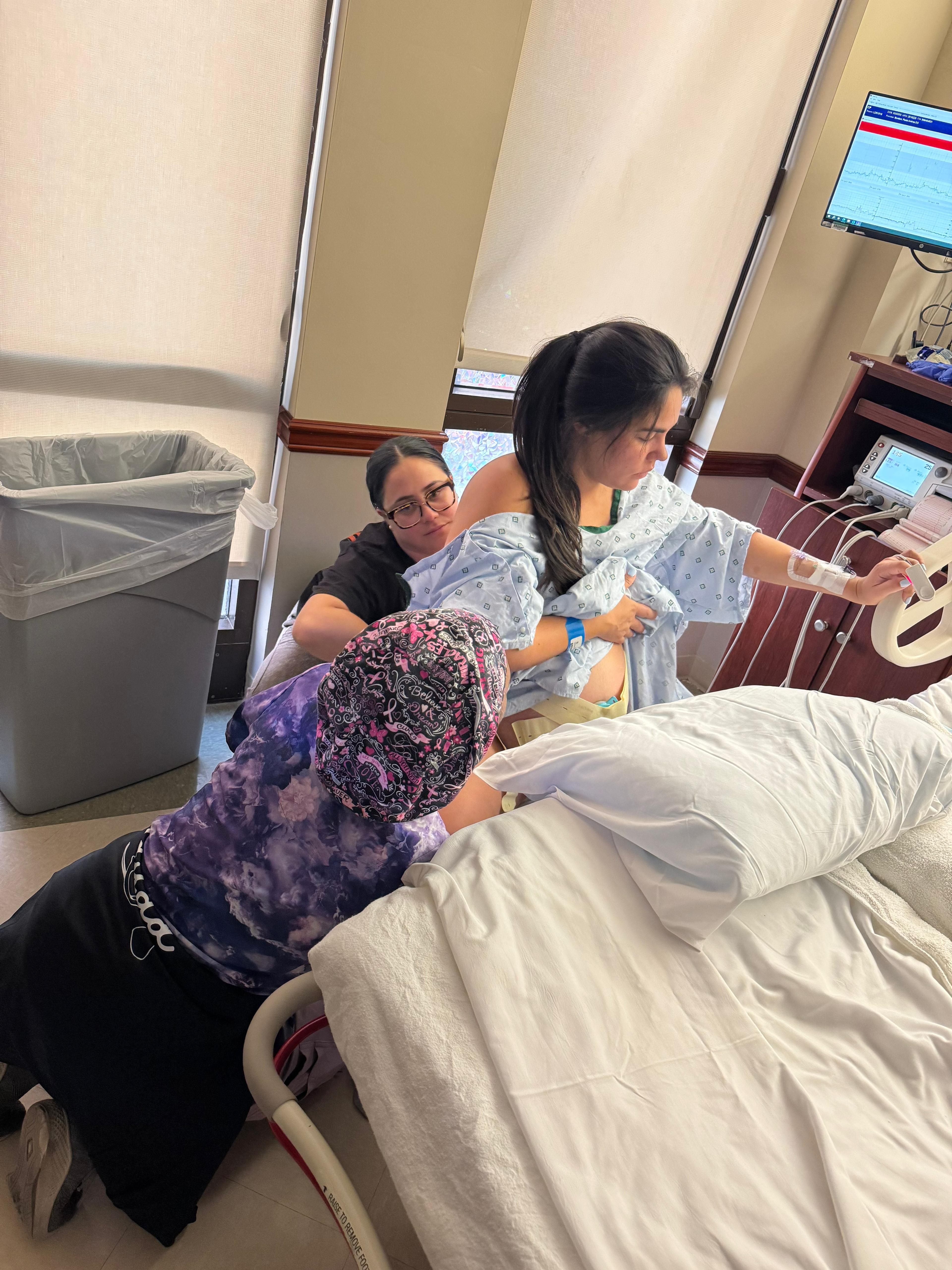 Hands-on labor support from the doula team during birth
