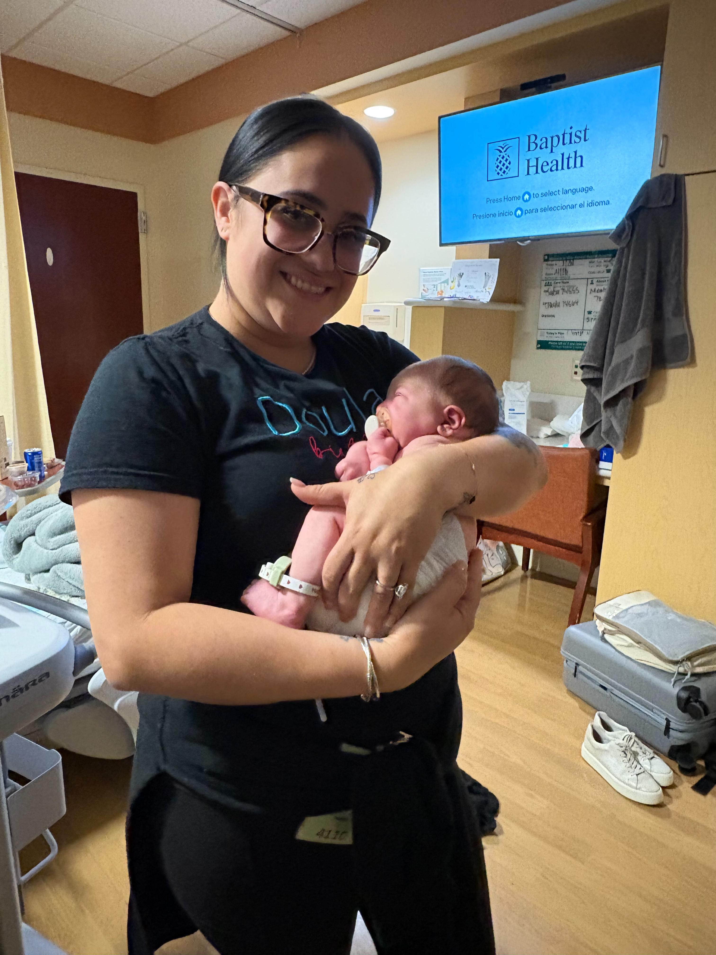 Rosy supporting a family with their newborn
