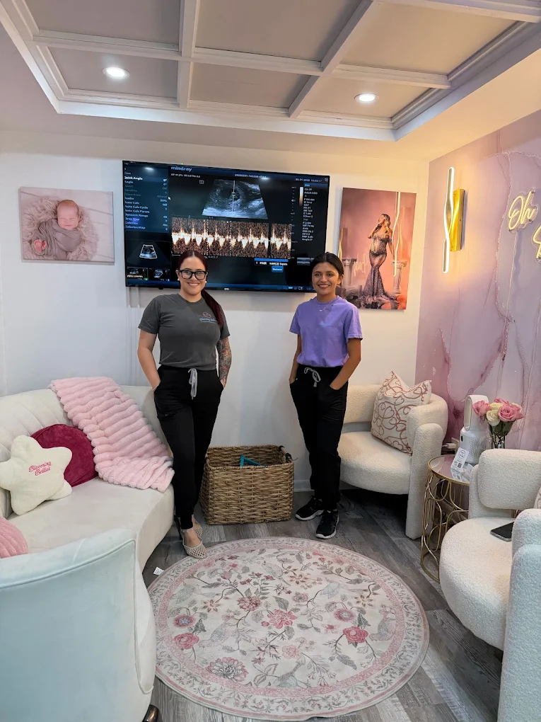 Blooming Bellies team in the warm studio lounge where prenatal testing and bloodwork are offered